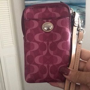 Leather coach card holder or cigarette holder. I do not smoke. Pink color